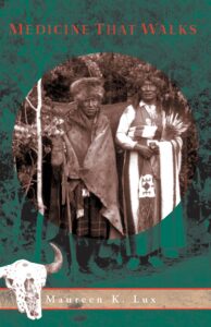 Book cover image for Medicine That Walks - sepia-toned photograph of two indigenous people standing in front of some trees.
